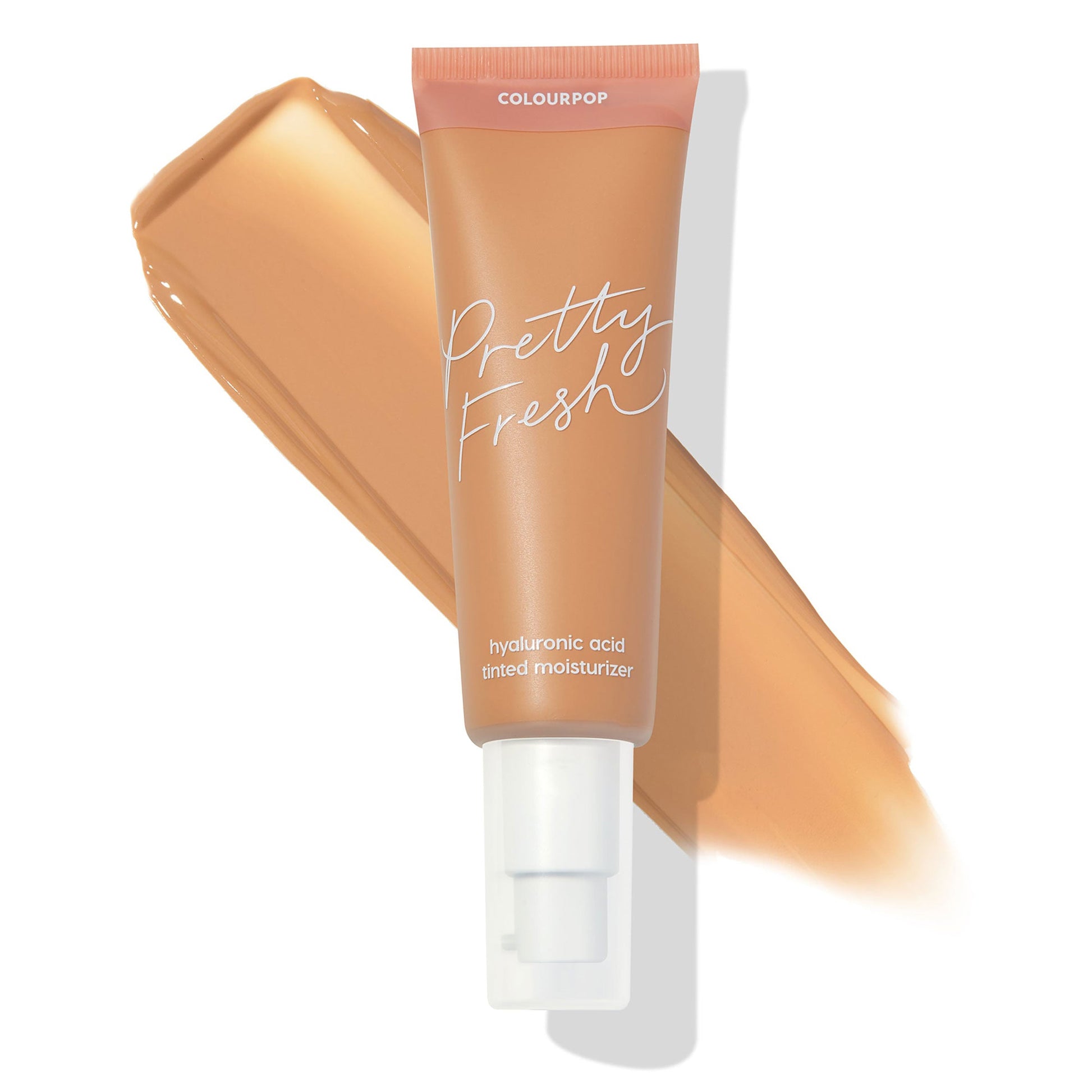 ColourPop Pretty Fresh Tinted Moisturizer Medium 10 N tube with white pump angled over a warm tan swatch, showcasing the neutral medium shade and hyaluronic acid formula on a clean white background.