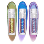 Feelin’ Bold ColourPop Chrome Liquid Shadow bundle shows three tubes standing upright, each with a bold multichrome swatch behind - green‑gold bronze, electric blue‑teal, and violet‑pink shifts - on a white studio background.